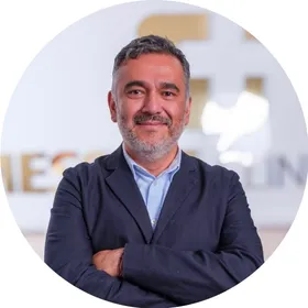 Dr Edward Gonzalez, arms folded, at The Messina Clinic